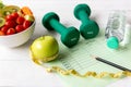 Diet Health Plan. Workout planning. Sport exercise equipment workout andÃÂ gym background with nutrition fresh salad Royalty Free Stock Photo